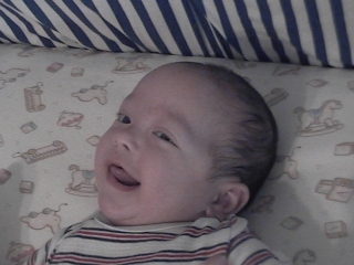 Smiling in my crib.